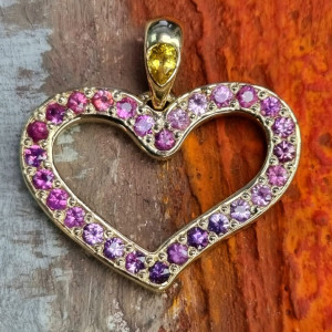 Золотое сердце "Love is..." с сапфирами фиолетовыми  